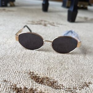 Gold and Black Oval Sunglasses